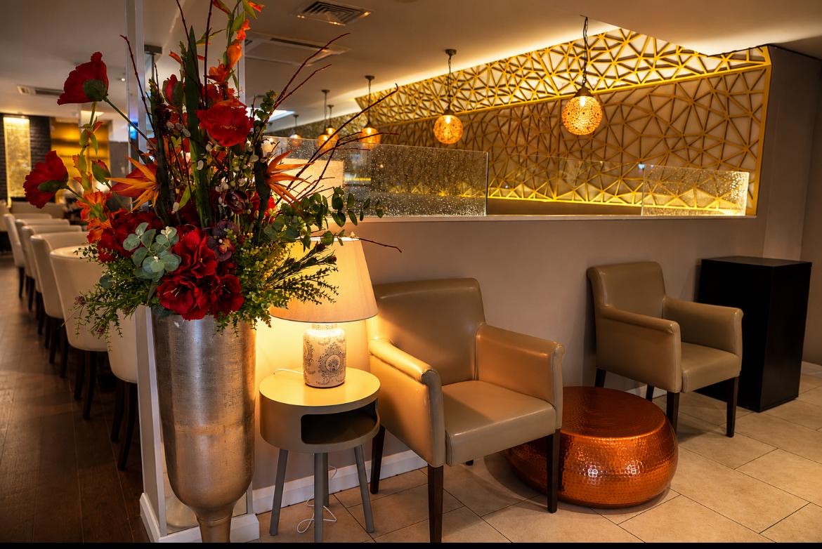 Floral display and intimate lounge seating at Valley Connection