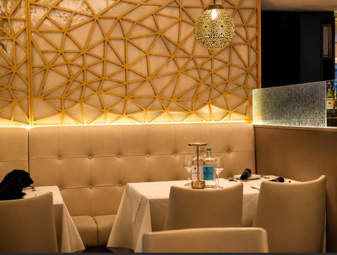 Elegant gold detailed dining room at Valley Connection